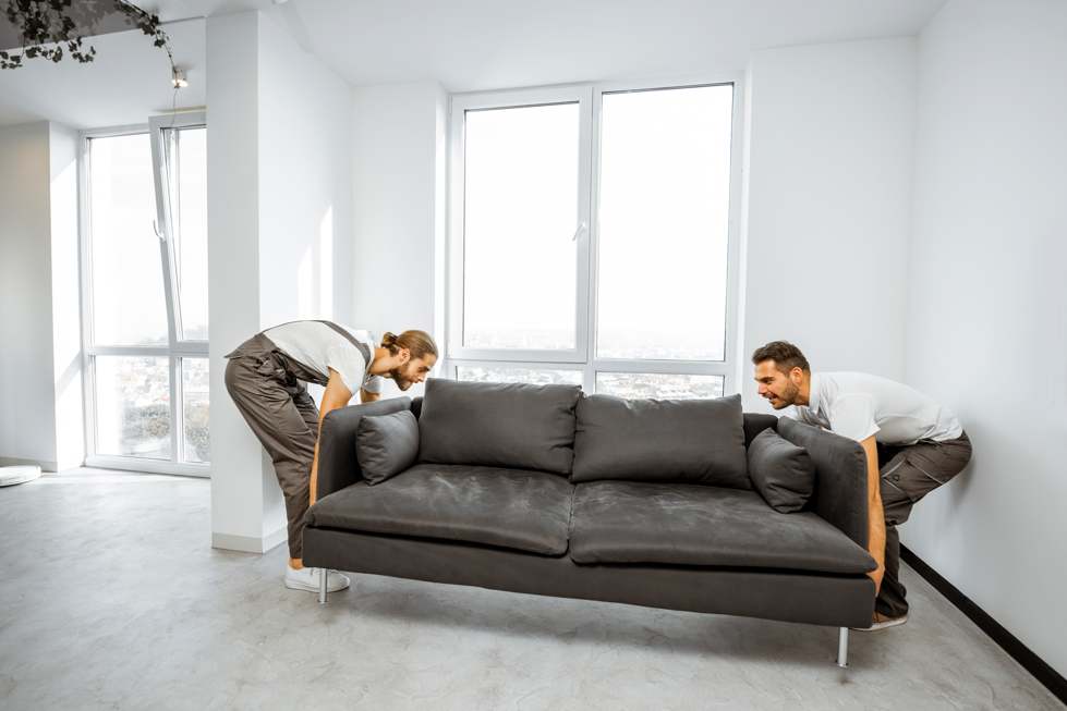 movers-placing-couch-at-home-636YUMB